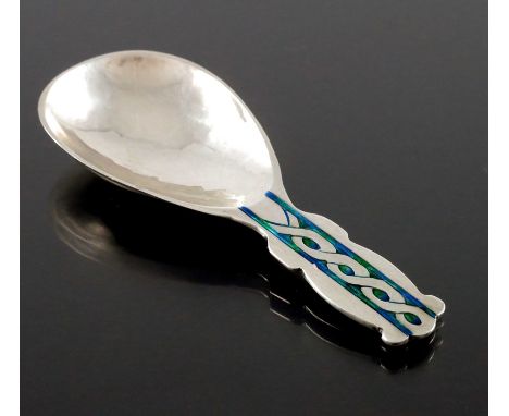 Archibald Knox for Liberty and Co., an Arts and Crafts silver and enamelled caddy spoon, Birmingham 1913, planished with egg 