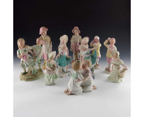 A collection of Gebruder Heubach bisque children figures, including various pairs, different sizes, 26cm high (12)