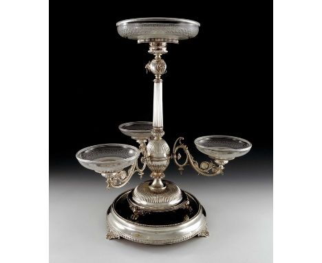 A large Victorian silver centrepiece epergne, Horace Woodward, London 1877, the fluted column with spherical lions mask and r