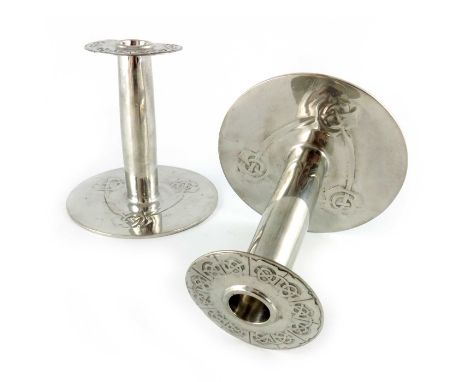 Archibald Knox for Liberty and Co., a pair of Arts and Crafts Tudric pewter candlesticks, model 08, the flat disc bases cast 