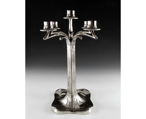 Imperial Zinn, a Jugendstil silver plated five light candelabrum, the square section fluted column terminating in a four foli