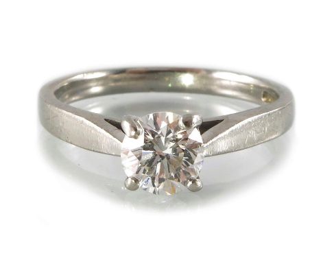 A platinum brilliant-cut diamond single-stone ring, with tapered shoulders, estimated diamond weight 0.75ct, H-I colour, SI c