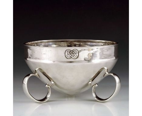 Archibald Knox for Liberty and Co., an Arts and Crafts Cymric silver bowl, Birmingham 1902, squat amphora form on three C loo