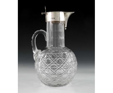 A George V silver mounted cut glass claret jug, Robert Pringle, London 1914, the globe body with hobnail cutting and loop han