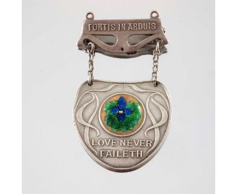 Charles Fleetwood Varley for Liberty and Co., an Arts and Crafts silver and enamelled pin badge, Birmingham 1911, the shield 
