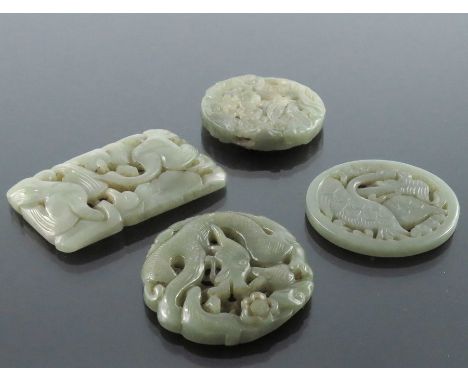Four Chinese reticulated carved jade pendants, including circular coiled dragon, goose and foliate scroll designs, 7.5cm (4)