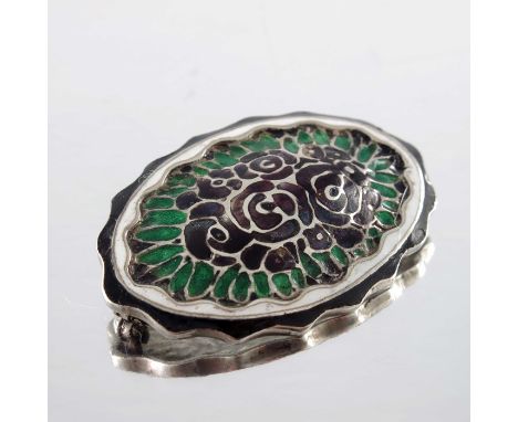 Theodor Fahrner, a Jugendstil silver and enamelled brooch, crimped oval form with central bouquet of roses in purple and gree