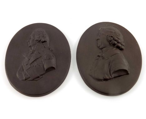 Two Wedgwood style portrait plaques, Nelson and Josiah Wedgwood, modelled in relief in brown basalt, bust form in profile, 9c