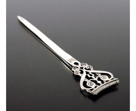 Ola M Gorie, a Scottish Iona style silver letter opener, Orkney, assay Edinburgh 1985, the open terminal with Pictish figure 