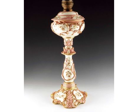 A large Coalport jewelled Banquet lamp, Chicago Exhibition 1893, the removable reservoir with relief moulded leaves and toole