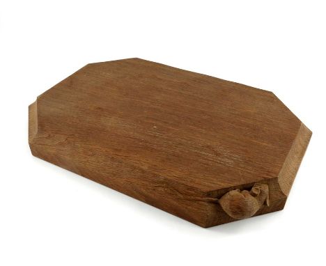 Robert Mouseman Thompson of Kilburn, an Arts and Crafts oak bread board, chamfered rectangular form with carved mouse, 43cm x