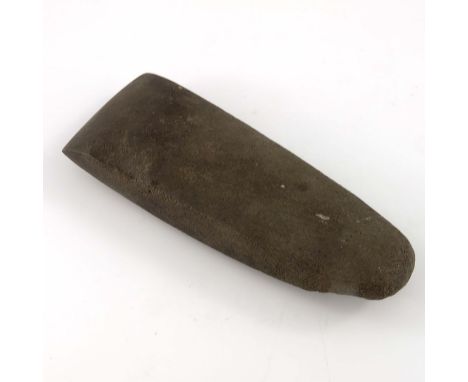 A Neolithic Adze blade, carved and polished stone, circa 3000 BC, tapered form with rounded end and angled edges, 17cm long