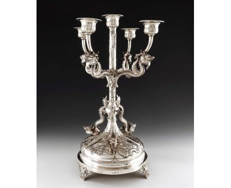 A Chinese silver five light candelabrum, Wang Hing, Hong Kong circa 1900, the lobed circular base embossed with panels of flo