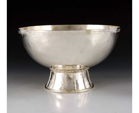 Edward Spencer for the Artificers Guild, an Arts and Crafts silver plated bowl, circa 1915, the planished hemispherical body 