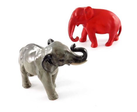 Charles Noke for Royal Doulton, two elephant figures, one trunk raised, HN891, the other in matte red glaze, 12cm high (2)