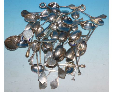 A large selection of silver and other golfing spoons; a shell caddy spoon, various dates