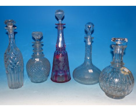 A 19th century pink overlaid glass decanter, and other decanters