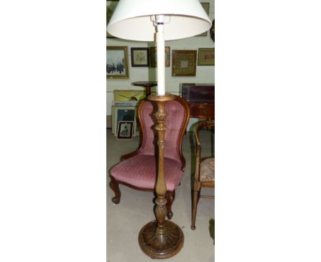 A carved mahogany torchère/standard lamp