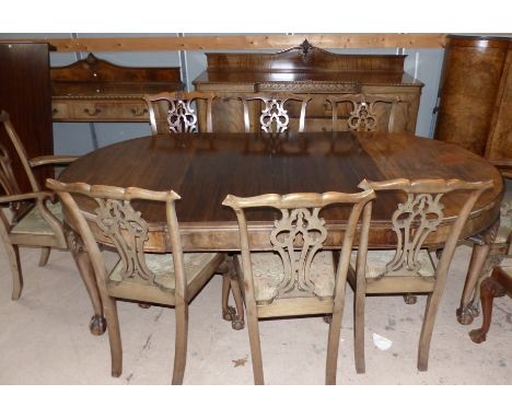 A large late 19th/early 20th century Chippendale style mahogany dining suite comprising oval extending table (3 spare leaves)