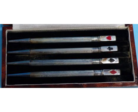 A cased set of 4 engine turned bridge propelling pencils