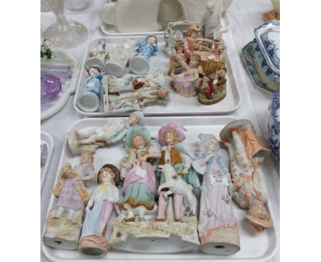 A selection of Victorian and later coloured bisque figures