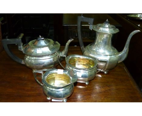 A Georgian style 5 piece tea and coffee set of rounded rectangular ribbed form, on bun feet, with ebonised finials and handle