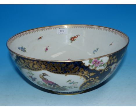A large 18th century Worcester style punch bowl with polychrome panels against a scale blue ground, diameter 12" (slight hair