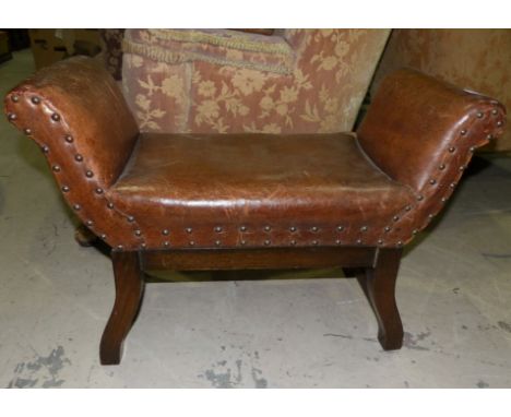 A 1930's studded leather scroll end stool
