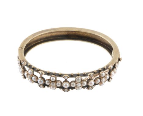 A Victorian pearl and diamond bangle, circa 1880  A Victorian pearl and diamond bangle,   circa 1880, the hinged bangle compo