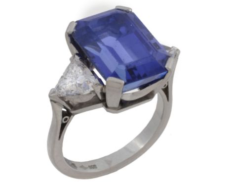 A platinum tanzanite and diamond three stone ring  A platinum tanzanite and diamond three stone ring,   the central rectangul