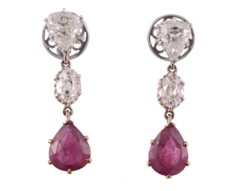 A pair of ruby and diamond drop earrings, the pear shaped rubies in a six...  A pair of ruby and diamond drop earrings,   the