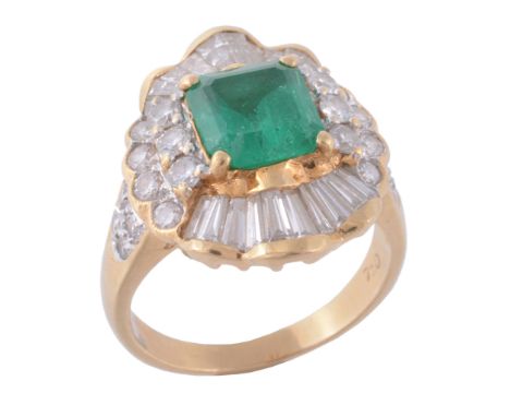 An emerald and diamond ballerina ring, the central square shaped emerald in...  An emerald and diamond ballerina ring,   the 