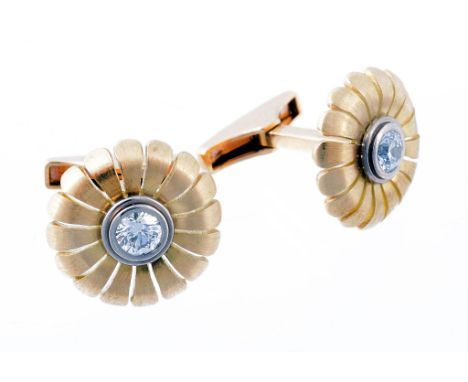 A pair of diamond flowerhead cufflinks by Mark Gold  A pair of diamond flowerhead cufflinks by Mark Gold  , the central colle