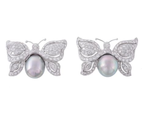 A pair of South Sea cultured pearl and diamond butterfly brooches  A pair of South Sea cultured pearl and diamond butterfly b