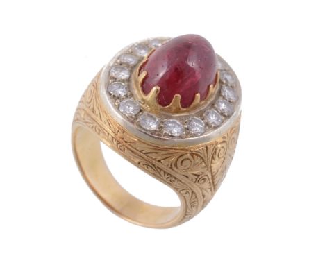 A cabochon ruby and diamond ring , the sugarloaf cabochon ruby within a...  A cabochon ruby and diamond ring  , the sugarloaf