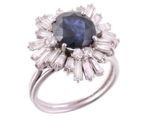 A sapphire and diamond ballerina ring, the central oval shaped sapphire  A sapphire and diamond ballerina ring,   the central