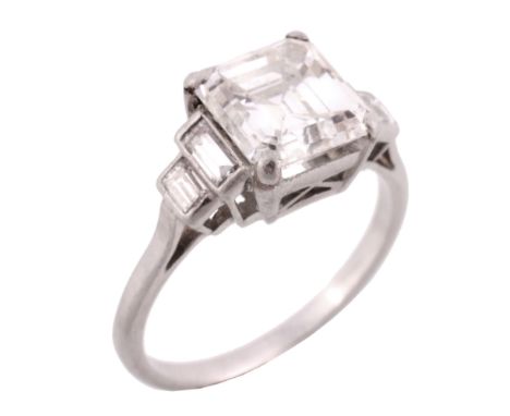A diamond single stone ring, the square step cut diamond weighing 2  A diamond single stone ring,   the square step cut diamo