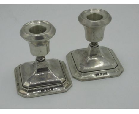 Pair of Geo.V silver hallmarked dwarf candlesticks on square tapering step bases Birmingham 1934 H8cm 