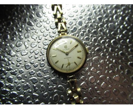 Ladys Cyma Cymaflex hand wound wrist watch 9ct gold case on matching bracelet stamped .375. snap on case back, Cyma 17 jewel 