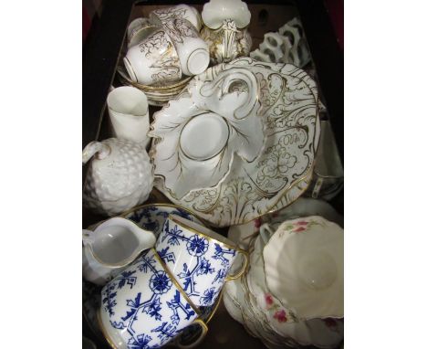 Part tea service with white gilt floral detail comprising 6 cups and saucers, milk jug, two serving plates, toast rack, two p