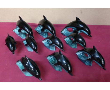 Poole Pottery dolphin figurines, three large and seven small (10) 
