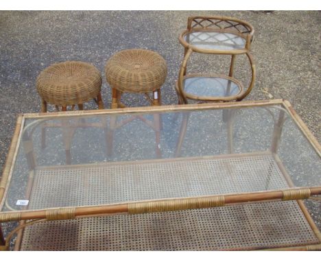 Bamboo rectangular coffee table with glass top and rattan shelf W.122cm D.61cm H.50cm, a similar two-tier oval side-table W.4