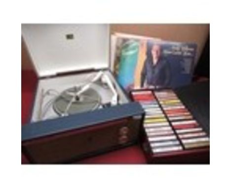 HMV 2002 record player with a selection of various 12" albums and a case of cassette tapes including wings Andy Williams, Joh