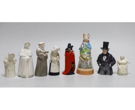 A collection of eight extinguishers including Worcester and Royal Doulton, the largest 13cm high
