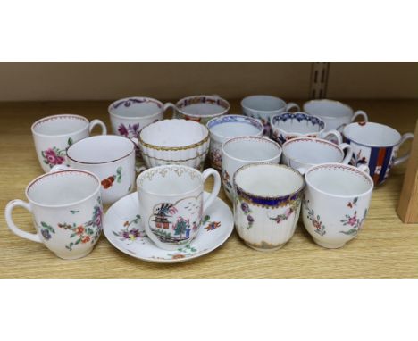 A collection of late 18th century Worcester and Lowestoft coffee cups and a saucer, many hand painted with flowers, the large