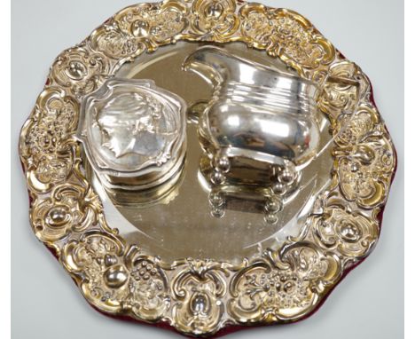 An Edwardian silver mounted circular easel mirror, Walker &amp; Hall, 26.5cm, an Art Nouveau silver trinket box, William Hutt