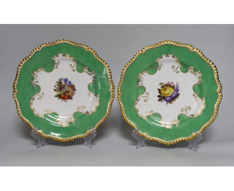 A pair of Flight, Barr and Barr Worcester plates, painted with central bouquets, c.1820, printed circular marks and impressed