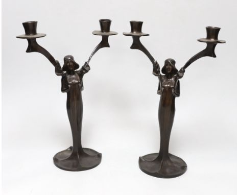 After Jules Moigniez (1835-1984) - a pair of bronze two branch candelabra, signed, dated 1902, 34cm high
