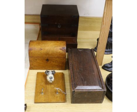 A 19th century mahogany brass bound stationary box, a domed tea caddy, an oak candle box and terrier brush stand,stationary b