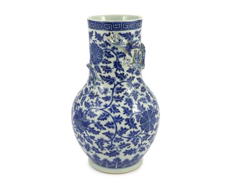 A Chinese blue and white ‘lotus’ vase, first half 19th century, 35cm high the cylindrical neck modelled in relief with a four